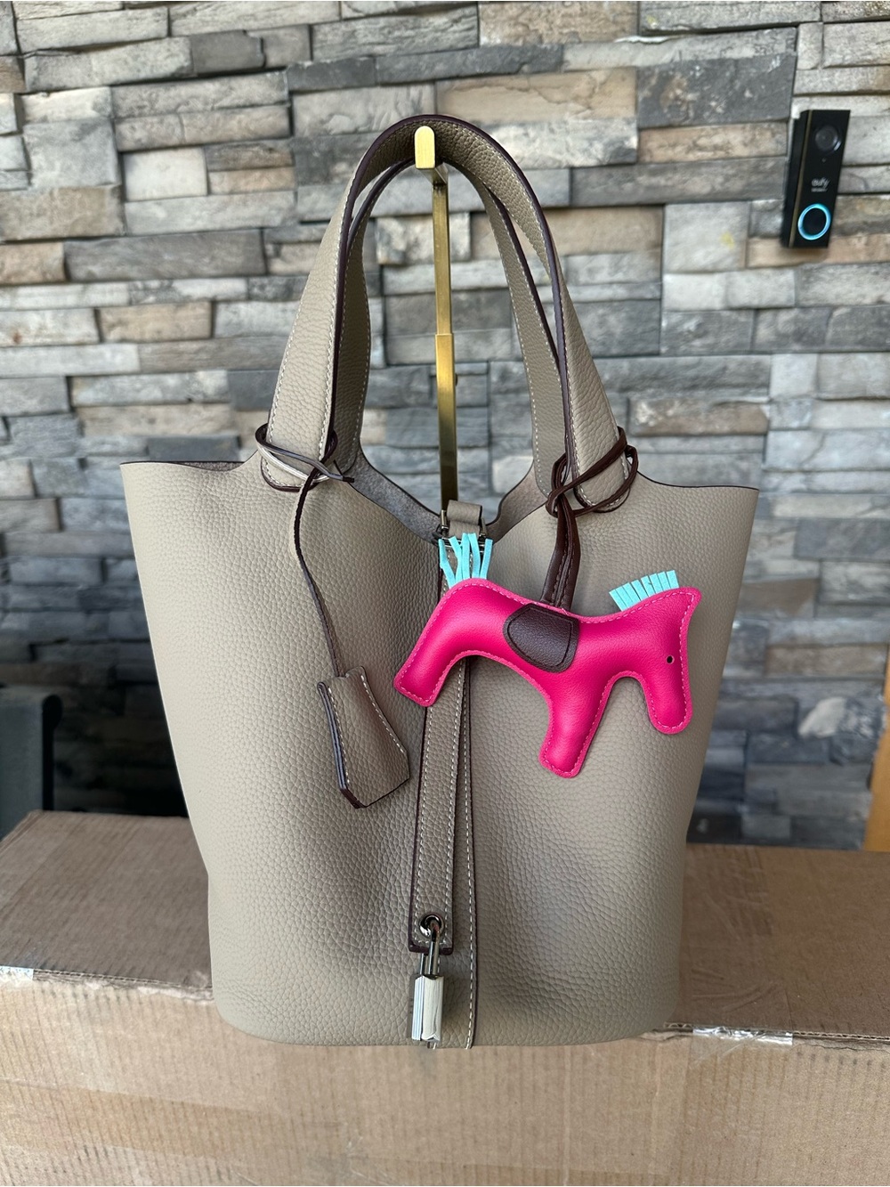 Women’s Taupe Pebbled Genuine Leather Bucket Bag with Pink Horse Charm Genuine
